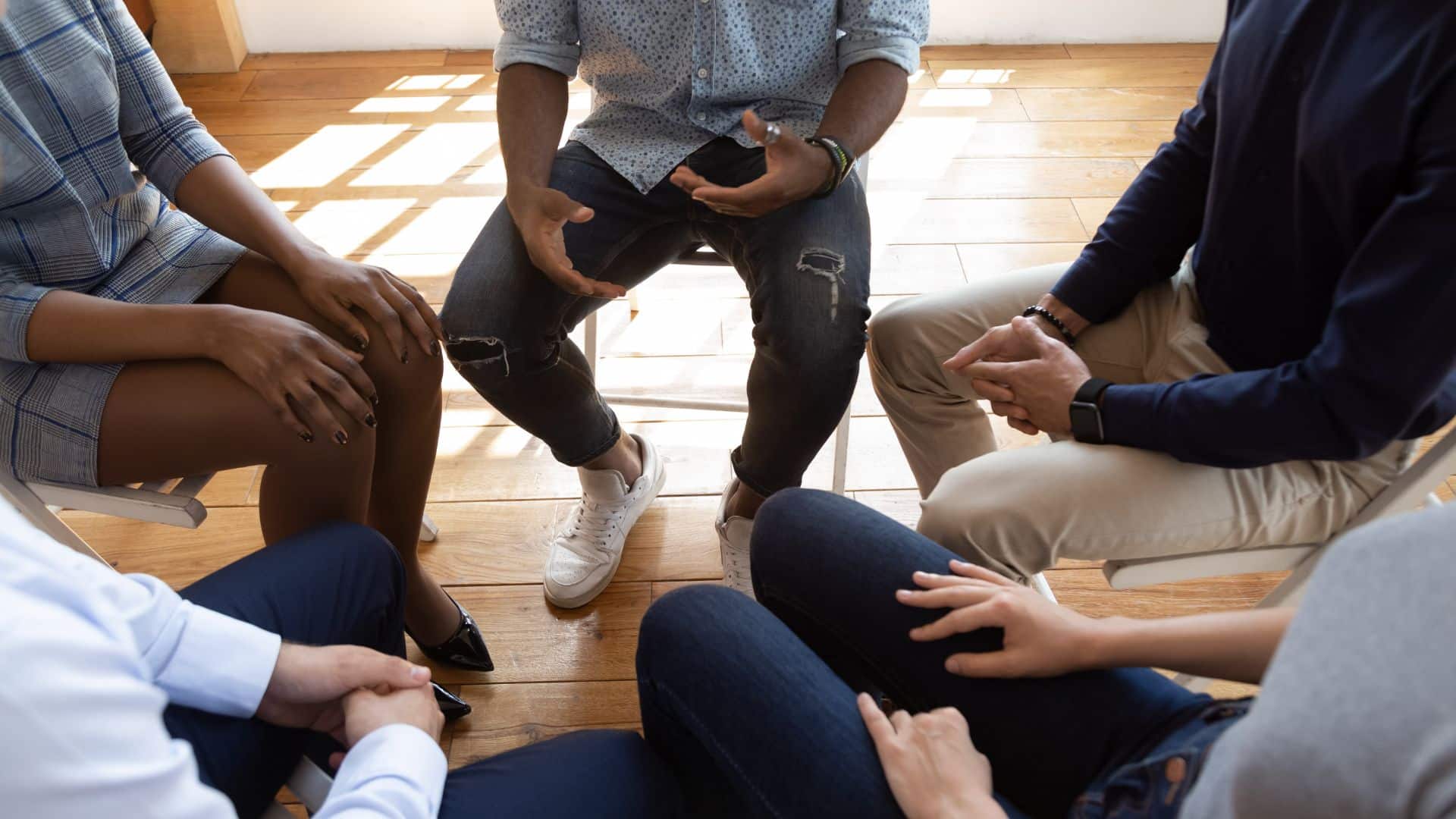 People sitting in circle and having a discussion