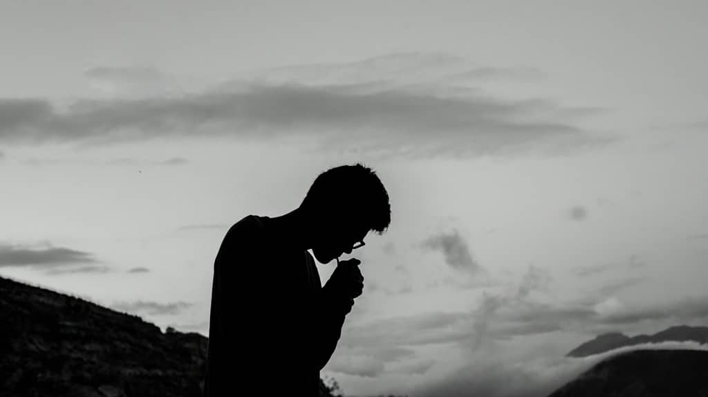 Sad man silhouette in black and white